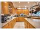 Well-equipped kitchen with wood cabinets, granite countertops and decorative backsplash at 8300 E Dixileta Dr # 253, Scottsdale, AZ 85266