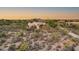 Aerial view of single-story home with desert landscaping at 8300 E Dixileta Dr # 253, Scottsdale, AZ 85266