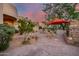 Outdoor patio with seating area near a stone fireplace at 8300 E Dixileta Dr # 253, Scottsdale, AZ 85266