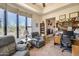 Spacious office with large window, fireplace, and built-in shelving at 8300 E Dixileta Dr # 253, Scottsdale, AZ 85266