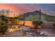 Landscaped backyard with desert plants and mountain backdrop at 8300 E Dixileta Dr # 253, Scottsdale, AZ 85266