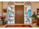 Entryway with stained glass and wood door at 8300 E Dixileta Dr # 253, Scottsdale, AZ 85266