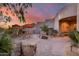Outdoor patio with fireplace, seating area, and desert landscaping at 8300 E Dixileta Dr # 253, Scottsdale, AZ 85266