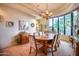 Spacious dining room featuring a large table, chandelier, and views to backyard at 8300 E Dixileta Dr # 253, Scottsdale, AZ 85266