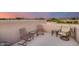 Rooftop patio with seating, mountain views, and sunset sky at 8300 E Dixileta Dr # 253, Scottsdale, AZ 85266