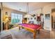 Relaxing game room featuring a pool table, large windows, and ample space at 8300 E Dixileta Dr # 253, Scottsdale, AZ 85266