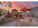Stone fireplace with seating area on a patio at 8300 E Dixileta Dr # 253, Scottsdale, AZ 85266