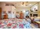 Spacious primary bedroom with fireplace, sitting area, and access to patio at 8300 E Dixileta Dr # 253, Scottsdale, AZ 85266