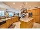 Large kitchen with an island, ample counter space, and wood cabinets at 8300 E Dixileta Dr # 253, Scottsdale, AZ 85266