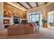 Expansive living area with a stone fireplace and comfortable seating at 8300 E Dixileta Dr # 253, Scottsdale, AZ 85266