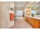 Elegant bathroom with double vanity, soaking tub, and decorative accents at 8300 E Dixileta Dr # 253, Scottsdale, AZ 85266