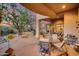 Outdoor patio with seating area, fireplace, and built-in grill at 8300 E Dixileta Dr # 253, Scottsdale, AZ 85266