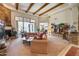 Open living room with a stone fireplace and access to the backyard at 8300 E Dixileta Dr # 253, Scottsdale, AZ 85266