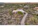 Aerial view of home showcasing desert landscape and driveway at 8300 E Dixileta Dr # 253, Scottsdale, AZ 85266