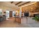 Inviting living room featuring a stone fireplace and wood beam accents at 8300 E Dixileta Dr # 253, Scottsdale, AZ 85266