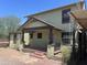 House exterior featuring a covered porch and mature trees at 1522 W Fillmore St, Phoenix, AZ 85007