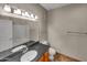 Clean bathroom with granite countertop, updated vanity, and bathtub at 10030 W Indian School Rd # 257, Phoenix, AZ 85037