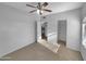 Bright bedroom with carpet flooring and access to a closet at 10030 W Indian School Rd # 257, Phoenix, AZ 85037