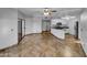 Spacious living area with tile floors and access to the kitchen at 10030 W Indian School Rd # 257, Phoenix, AZ 85037