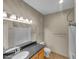 Well-lit bathroom with granite countertop and bathtub at 10030 W Indian School Rd # 257, Phoenix, AZ 85037