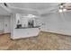 Open kitchen features granite countertops and stainless steel appliances at 10030 W Indian School Rd # 257, Phoenix, AZ 85037