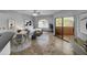 Living room with tiled floors, a sofa, and access to a patio at 10030 W Indian School Rd # 257, Phoenix, AZ 85037
