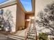 Exterior view of a building showing stairs leading to an entrance at 10030 W Indian School Rd # 257, Phoenix, AZ 85037