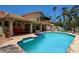 Large turquoise pool with a spa, and a spacious backyard at 19619 N 69Th Ave, Glendale, AZ 85308