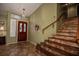 Welcoming entryway with tiled floors and staircase at 19619 N 69Th Ave, Glendale, AZ 85308