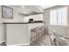 Kitchen with white cabinets, granite counters, and breakfast bar at 21655 N 36Th Ave # 104, Glendale, AZ 85308