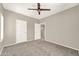 Versatile bedroom with ceiling fan and access to hallway at 21655 N 36Th Ave # 104, Glendale, AZ 85308