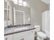 Clean bathroom with granite countertop, white cabinets, and a shower/tub combo at 21655 N 36Th Ave # 104, Glendale, AZ 85308