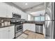 Modern kitchen with stainless steel appliances and white cabinets at 21655 N 36Th Ave # 104, Glendale, AZ 85308