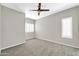 Bright bedroom with ceiling fan and neutral decor at 21655 N 36Th Ave # 104, Glendale, AZ 85308
