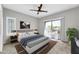 Main bedroom with plush carpet and access to balcony at 21655 N 36Th Ave # 104, Glendale, AZ 85308