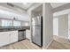 Modern kitchen with stainless steel appliances and granite countertops at 21655 N 36Th Ave # 104, Glendale, AZ 85308