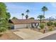 Single story home with a brown tile roof and white exterior at 2320 E Shangri La Rd, Phoenix, AZ 85028
