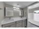 Updated bathroom with dual sinks and a shower/tub combo at 2320 E Shangri La Rd, Phoenix, AZ 85028