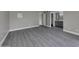 Spacious bedroom with gray floors and an ensuite bathroom at 2320 E Shangri La Rd, Phoenix, AZ 85028
