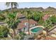 Aerial view of home with pool, mountain views, and palm trees at 2320 E Shangri La Rd, Phoenix, AZ 85028