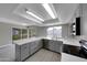 Modern kitchen with gray cabinets and quartz counters at 2320 E Shangri La Rd, Phoenix, AZ 85028