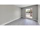 Well-lit bedroom with gray floors and a window view at 2320 E Shangri La Rd, Phoenix, AZ 85028