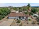 Single story house with mountain views and palm trees at 2320 E Shangri La Rd, Phoenix, AZ 85028