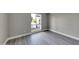 Simple bedroom with gray floors and a large window at 2320 E Shangri La Rd, Phoenix, AZ 85028
