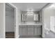 Modern bathroom with dual sinks and gray cabinets at 2320 E Shangri La Rd, Phoenix, AZ 85028