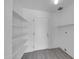 Laundry room with white shelving and gray flooring at 2320 E Shangri La Rd, Phoenix, AZ 85028
