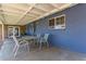 Covered patio with table and chairs, adjacent to house at 1360 W 15Th St, Tempe, AZ 85281