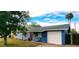 Blue house with white garage door and red front door at 1360 W 15Th St, Tempe, AZ 85281