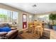 Bright sunroom features a table, chairs, and comfortable seating at 1360 W 15Th St, Tempe, AZ 85281