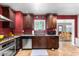 Kitchen with dark wood cabinets and granite countertops at 1360 W 15Th St, Tempe, AZ 85281